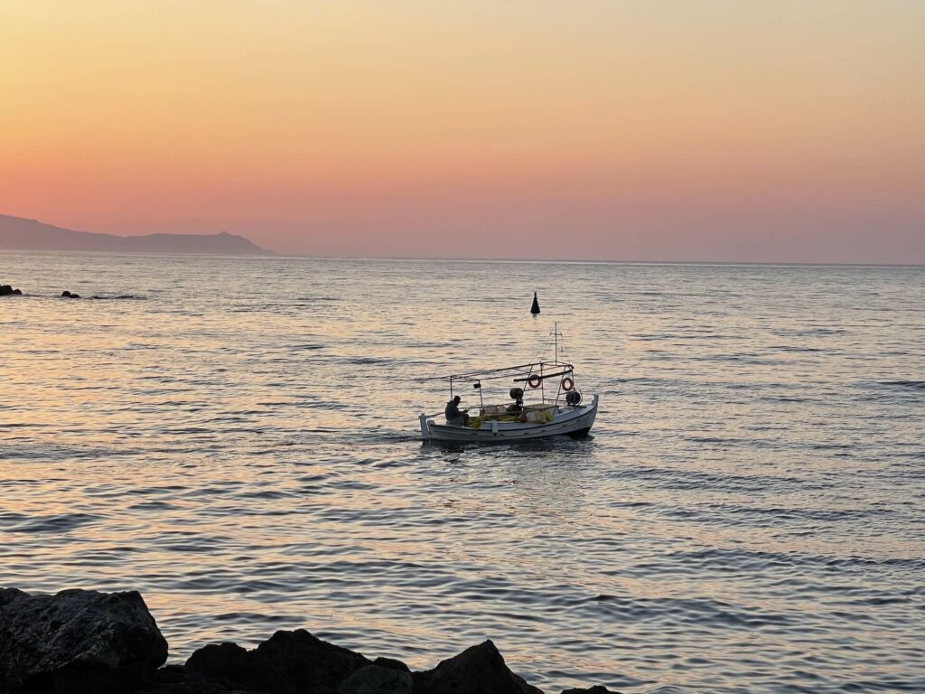 fishing-boat-in-sunset-in-greece-2022-11-11-17-47-56-utc (1)